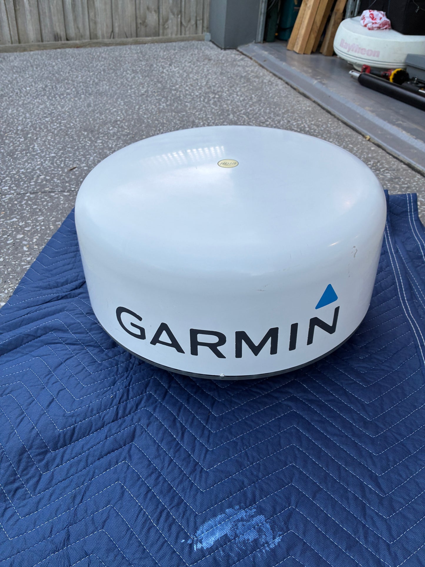 Garmin GMR 18 HD radome radar scanner front view with Garmin logo