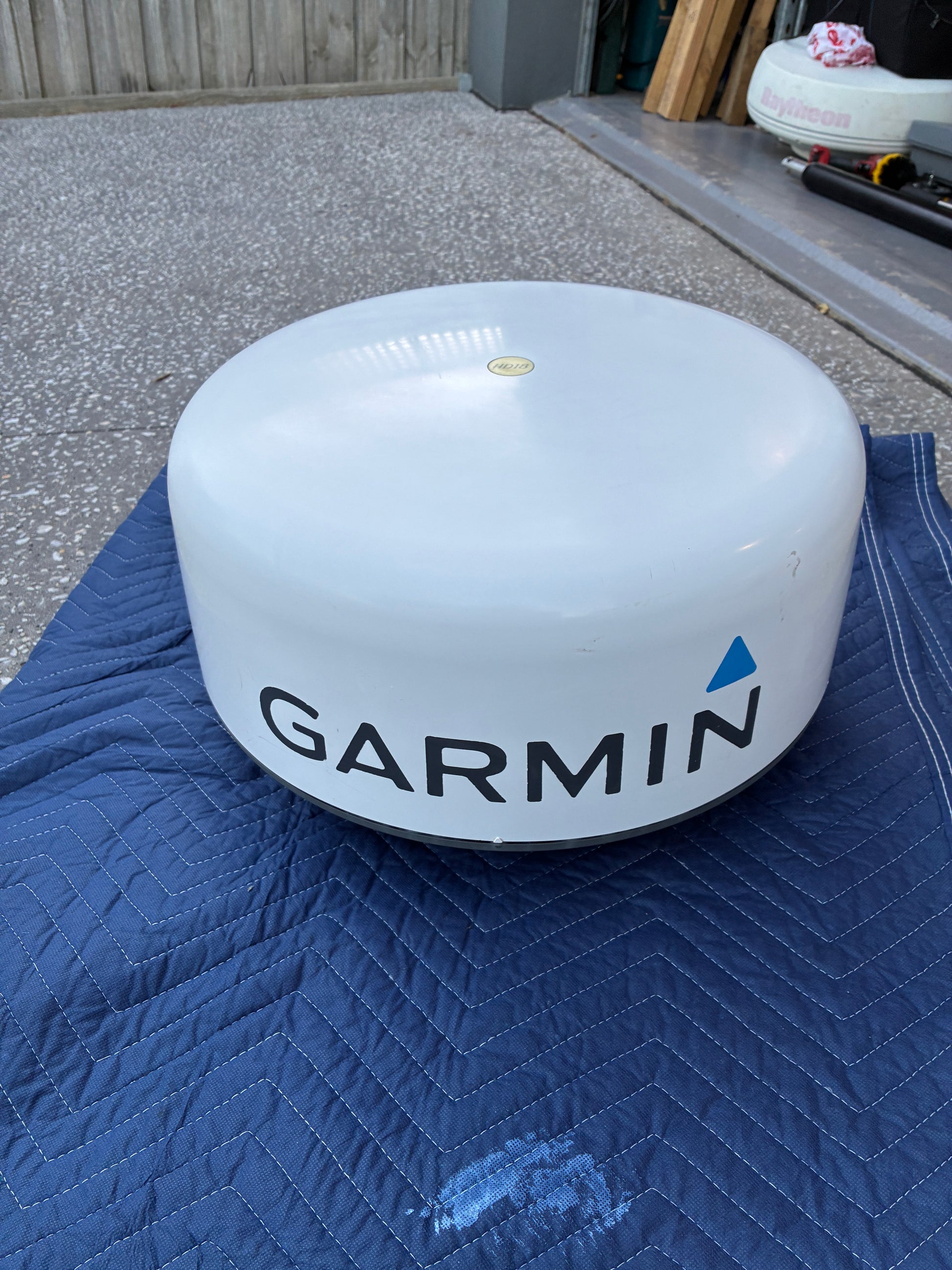 Garmin GMR 18 HD radome radar scanner front view with Garmin logo