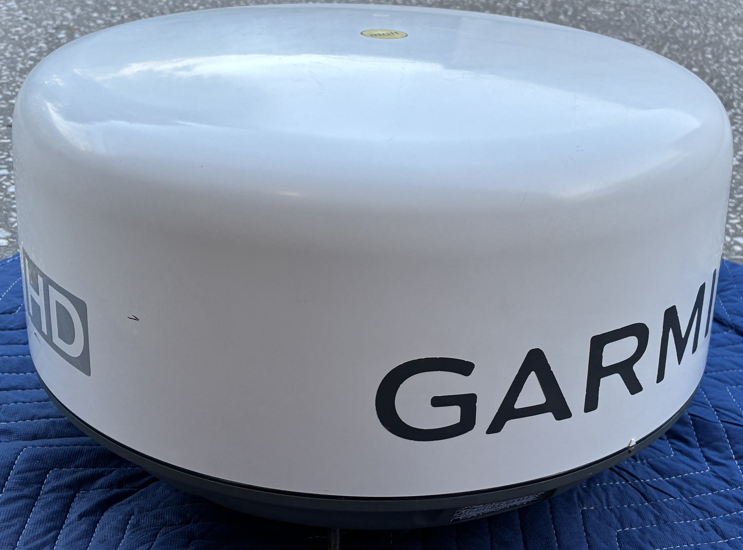 Garmin GMR 18 HD marine radar dome side view showing cosmetic condition