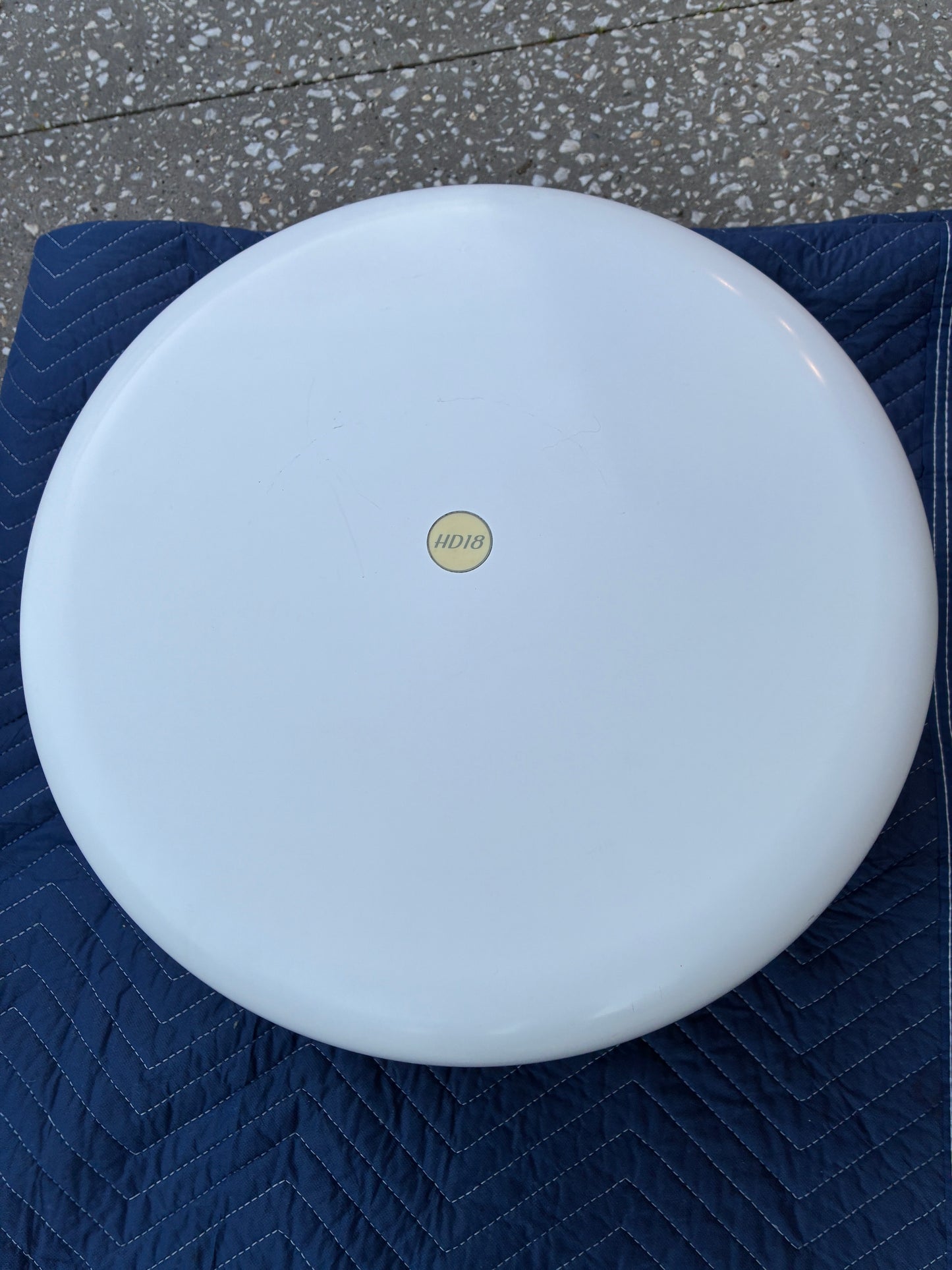 Garmin GMR 18 HD radar dome top view showing HD18 badge