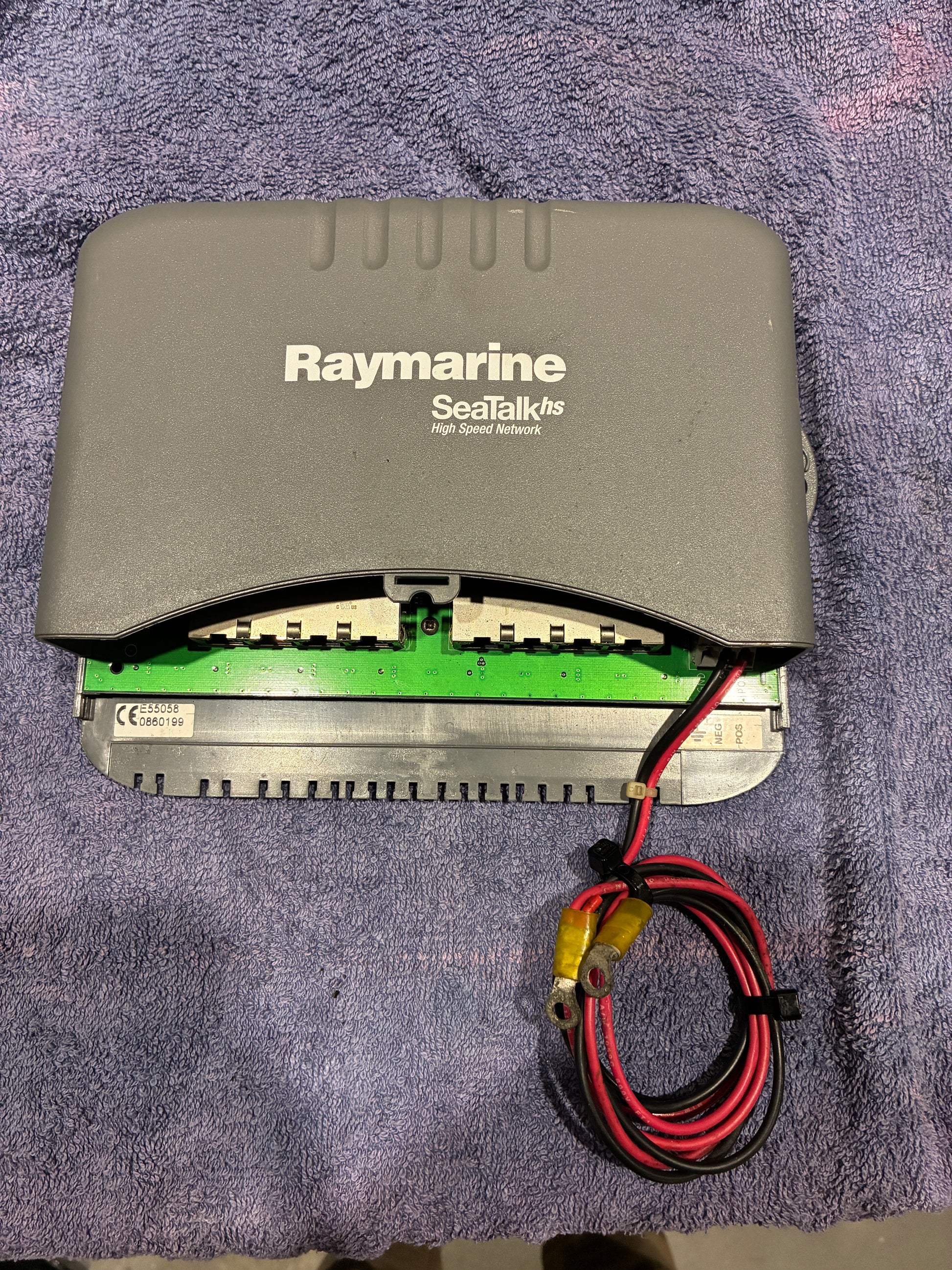 Raymarine E55058 SeaTalk HS network switch front view with cover and network ports