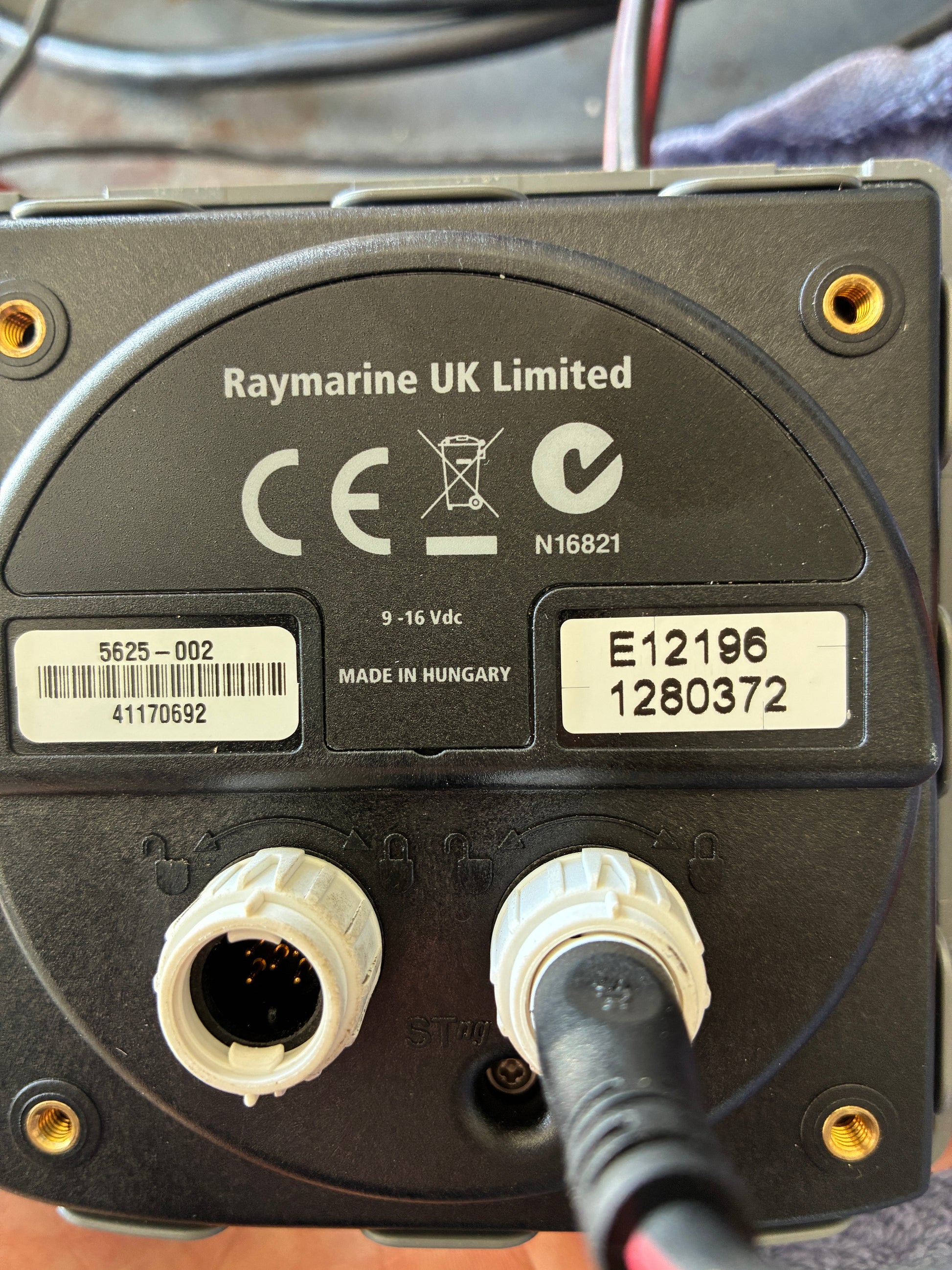 Raymarine ST70 autopilot control head rear label showing part number E12196 and serial number
